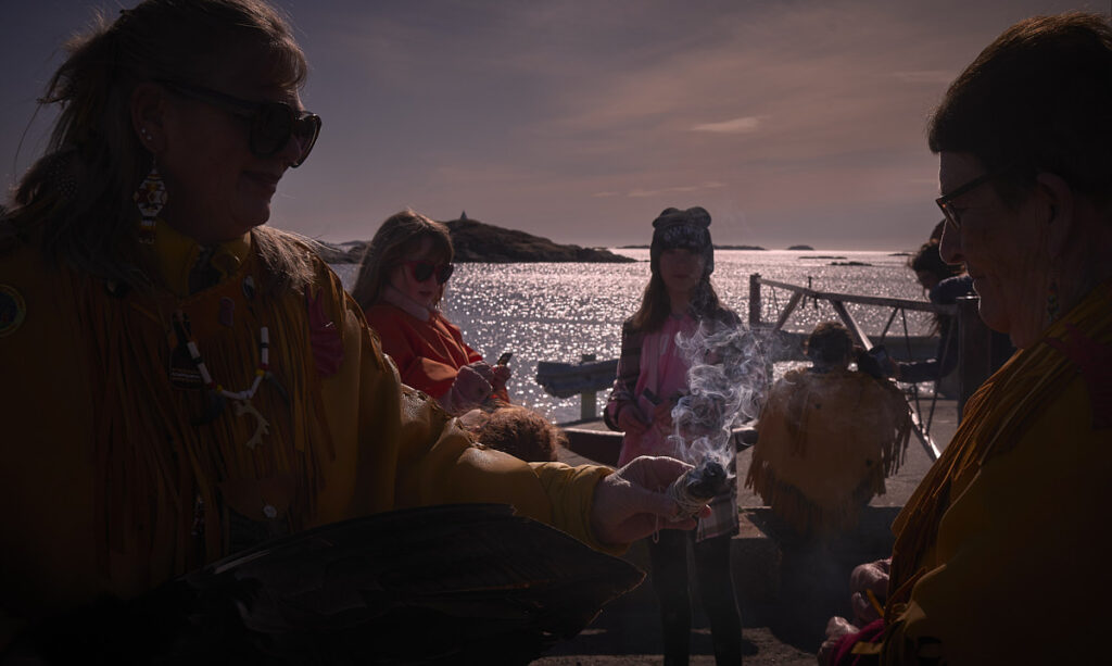 Indigenous smudge ceremony during total eclipse of the sun at Eclipse Island, Newfoundland, Canada. Photo by Greg Locke